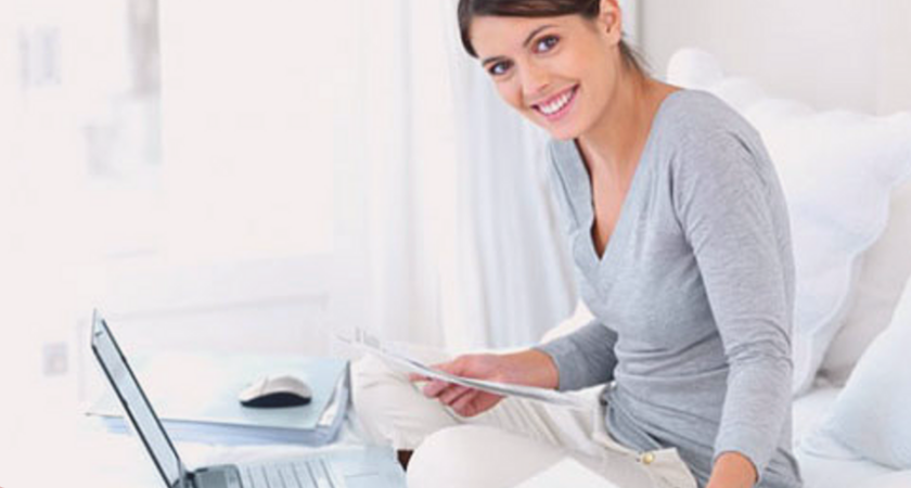 Girl on bed with laptop